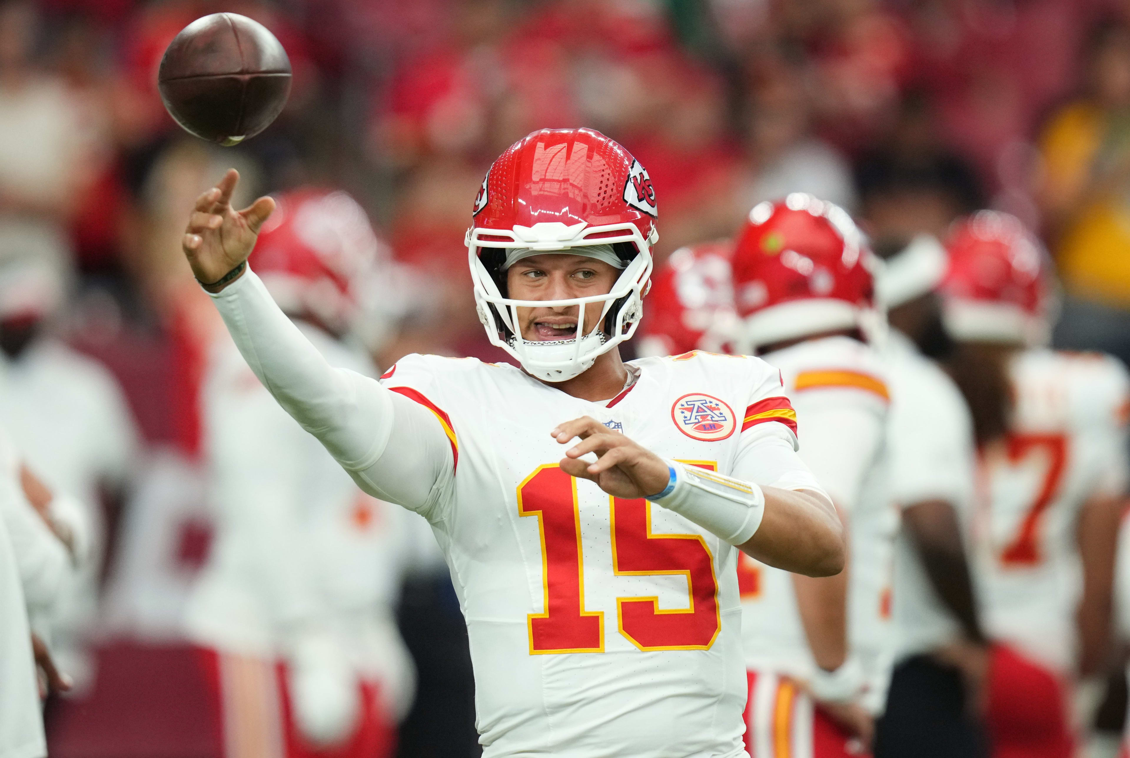 Aug 9, 2025; Glendale, Ariz, U.S.; Kansas City Chiefs quarterback Patrick Mahomes (15) warms up before their preseason game against the Arizona Cardinals at State Farm Stadium on Aug. 9.