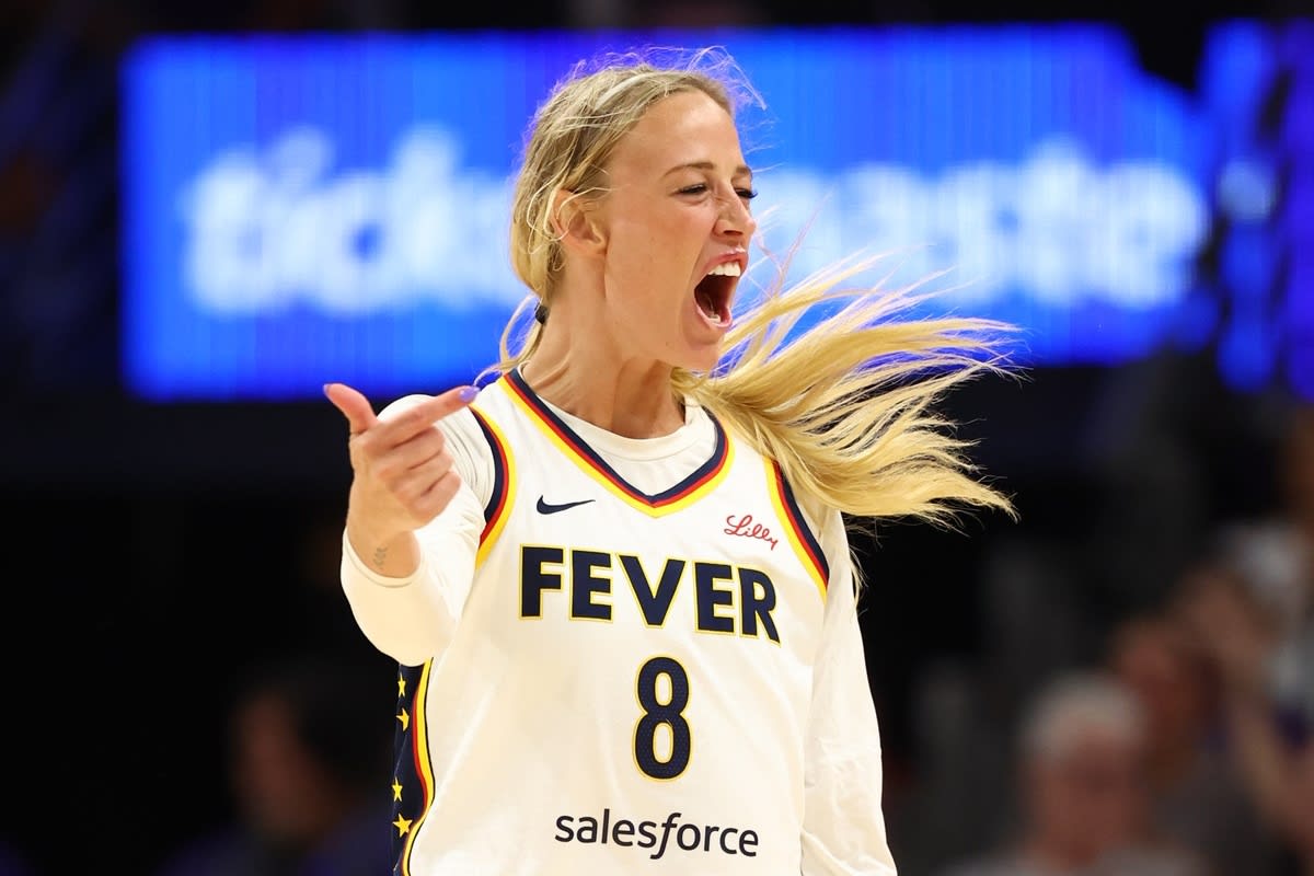 Indiana Fever guard Sophie Cunningham (8) celebrates a three point shot