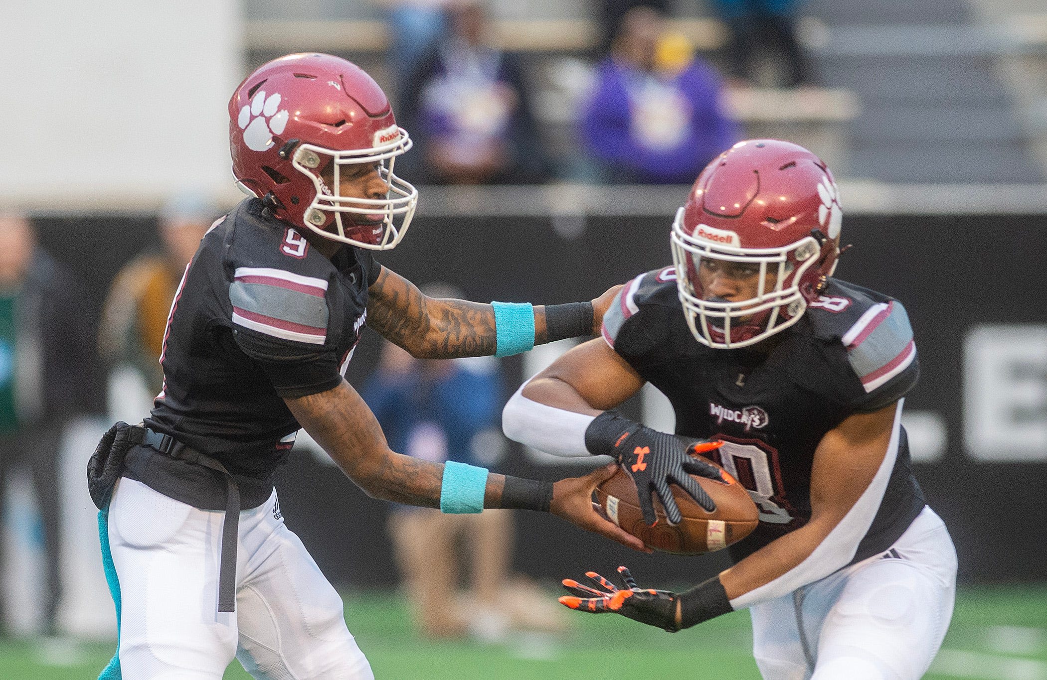 Louisville High School quarterback Zavier Hunt (9) and running back Zaiden Jernigan (8)