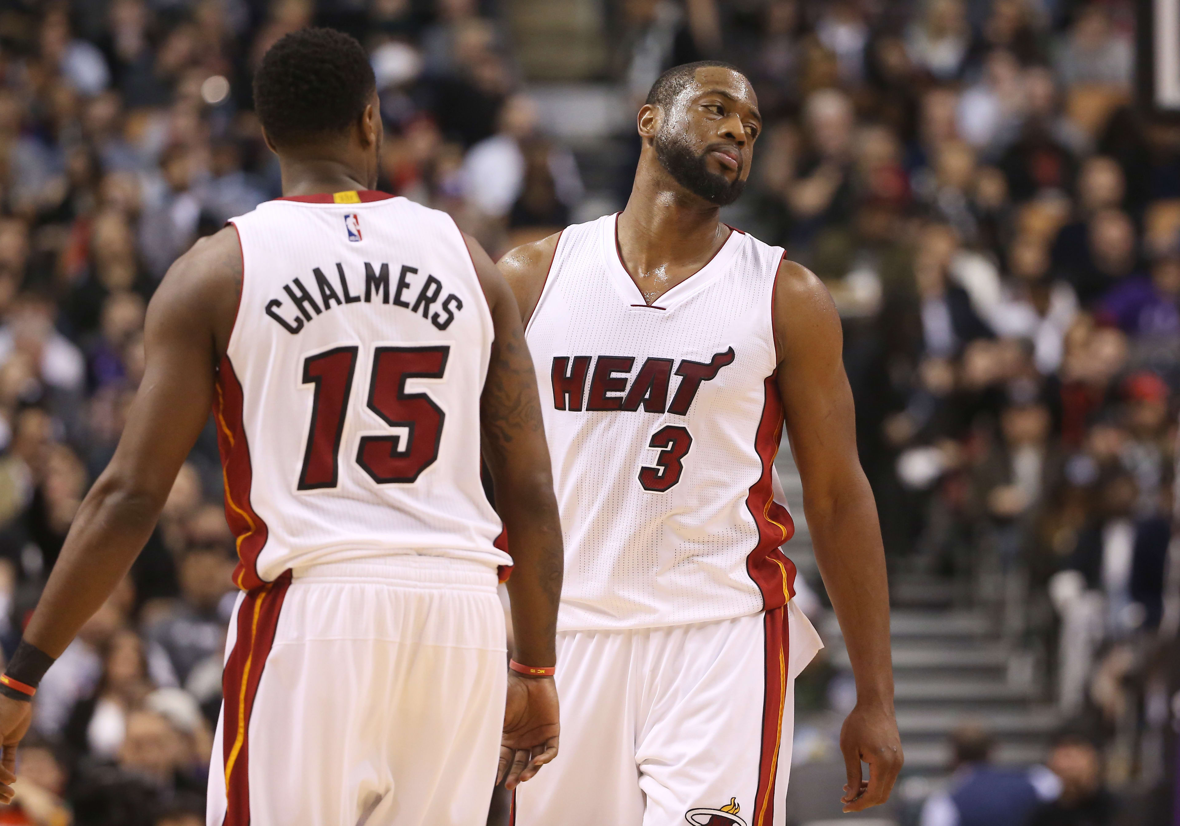 Miami Heat shooting guard Dwyane Wade (3) reacts next to guard Mario Chalmers.