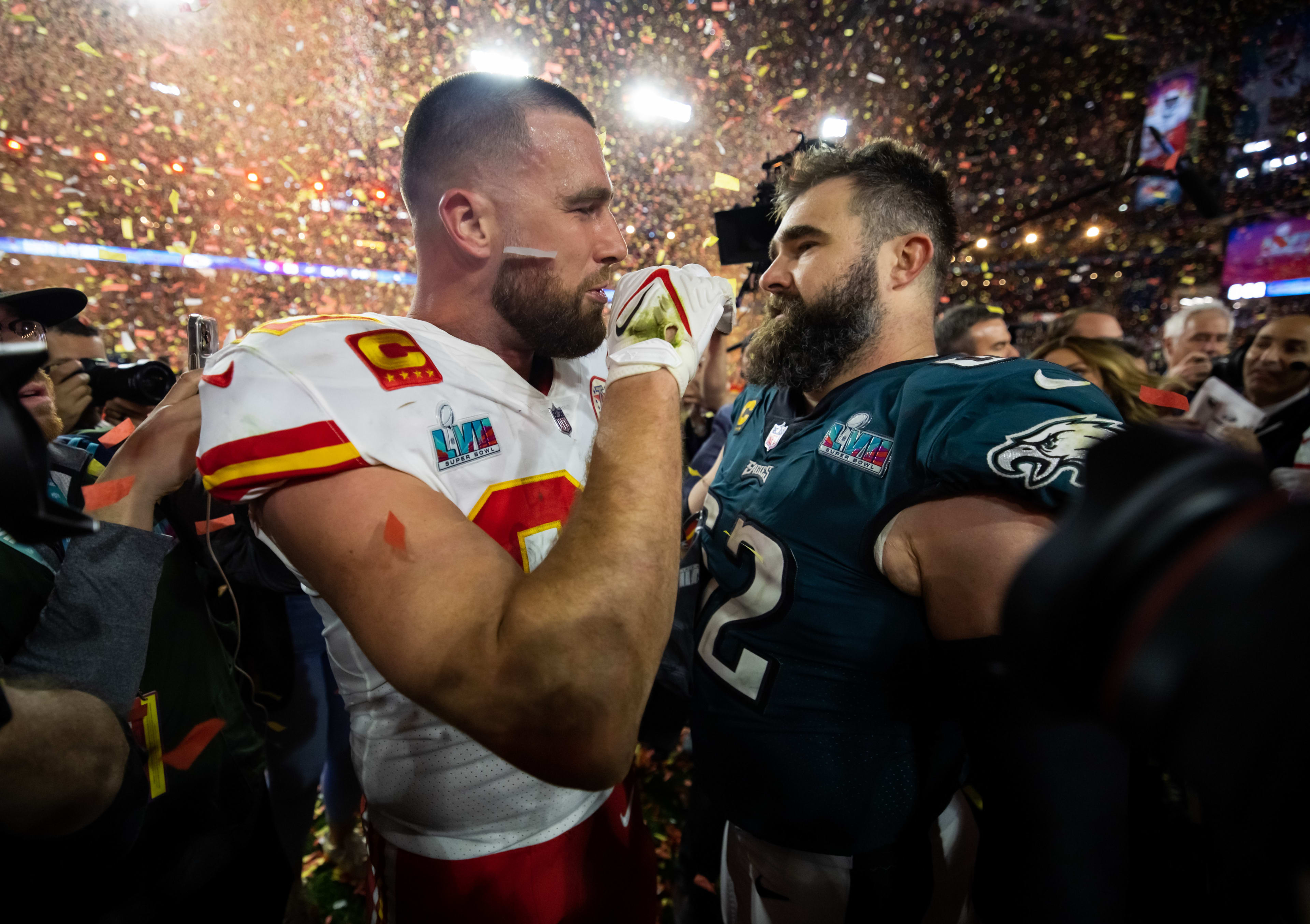 Feb 12, 2023; Glendale, Arizona, US; Kansas City Chiefs tight end Travis Kelce (87) talks with his brother Philadelphia Eagles center Jason Kelce (62) after Super Bowl LVII at State Farm Stadium. Mandatory Credit: Mark J. Rebilas-Imagn Images