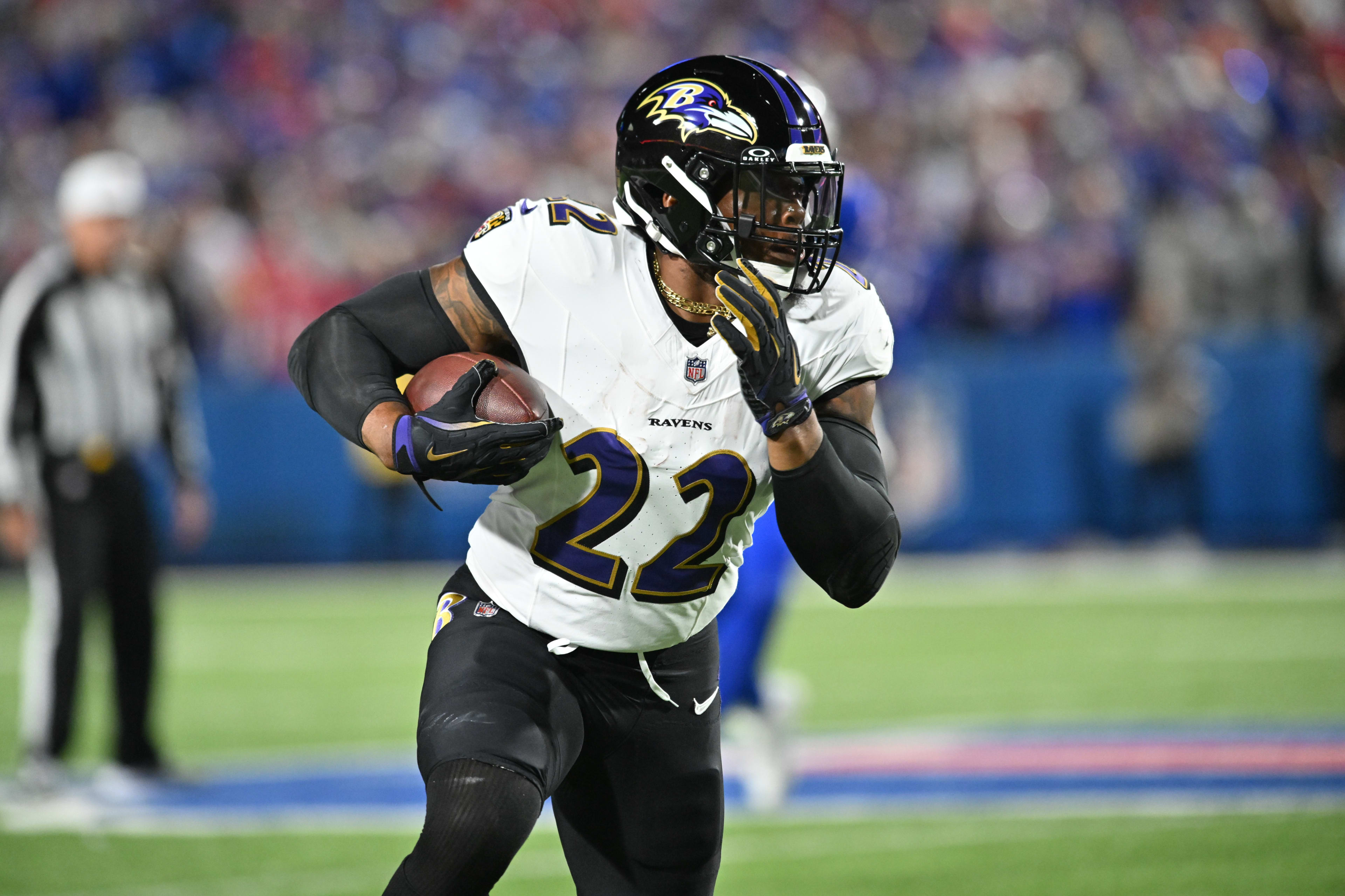 Baltimore Ravens running back Derrick Henry carries the ball against the Bills before his late fumble.