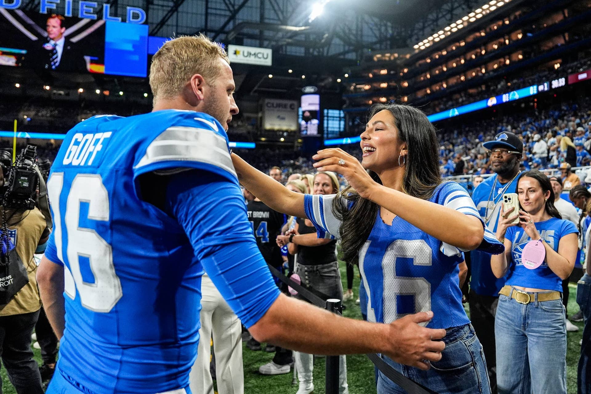 Detroit Lions quarterback Jared Goff hugs his wife Christen Harper