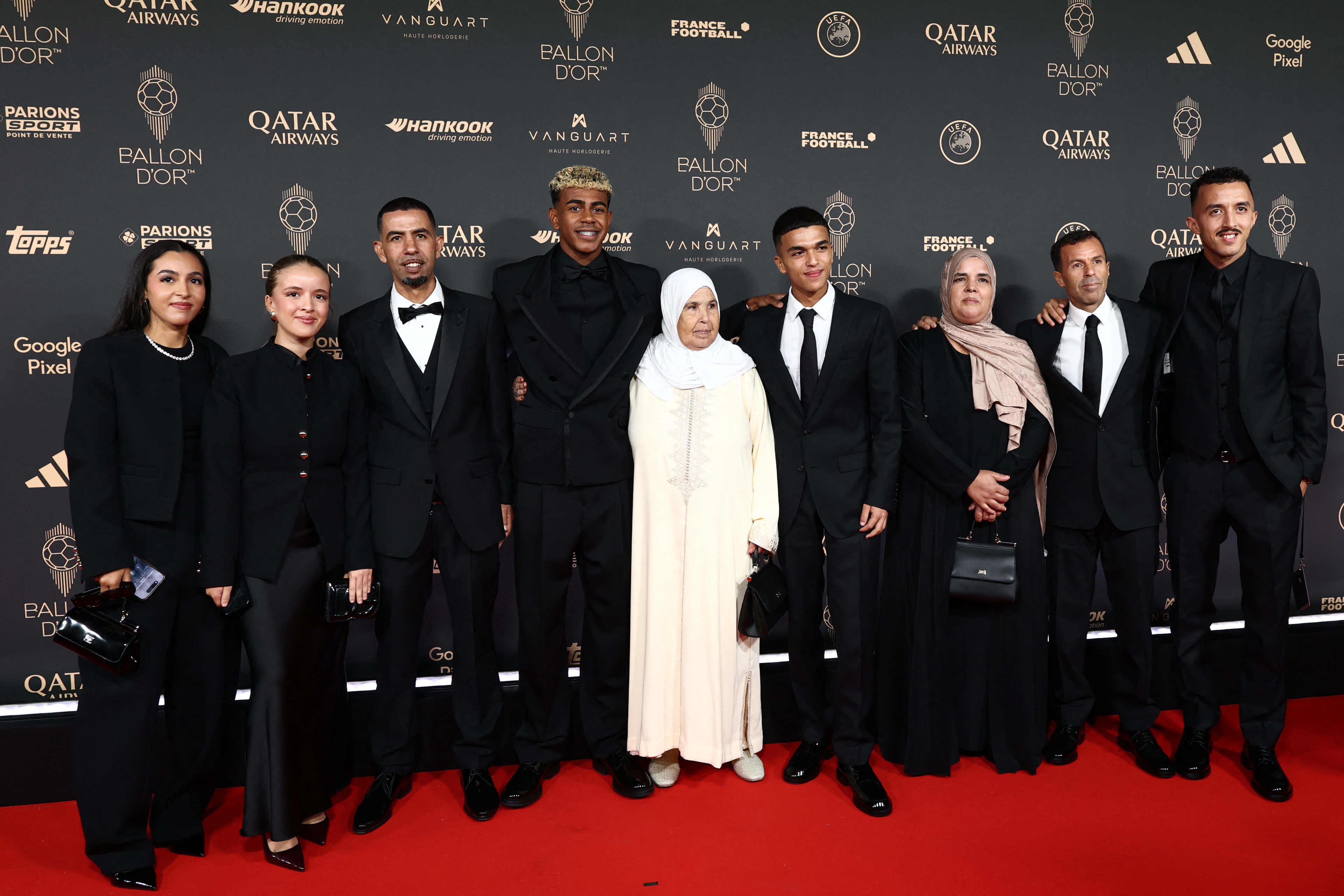 Barcelona’s Spanish forward Lamine Yamal (4thL) poses with his family upon arrival before the 2025 Ballon d’Or France Football award ceremony at the Theatre du Chatelet in Paris on September 22, 2025. (Photo by FRANCK FIFE / AFP) (Photo by FRANCK FIFE/AFP via Getty Images)
