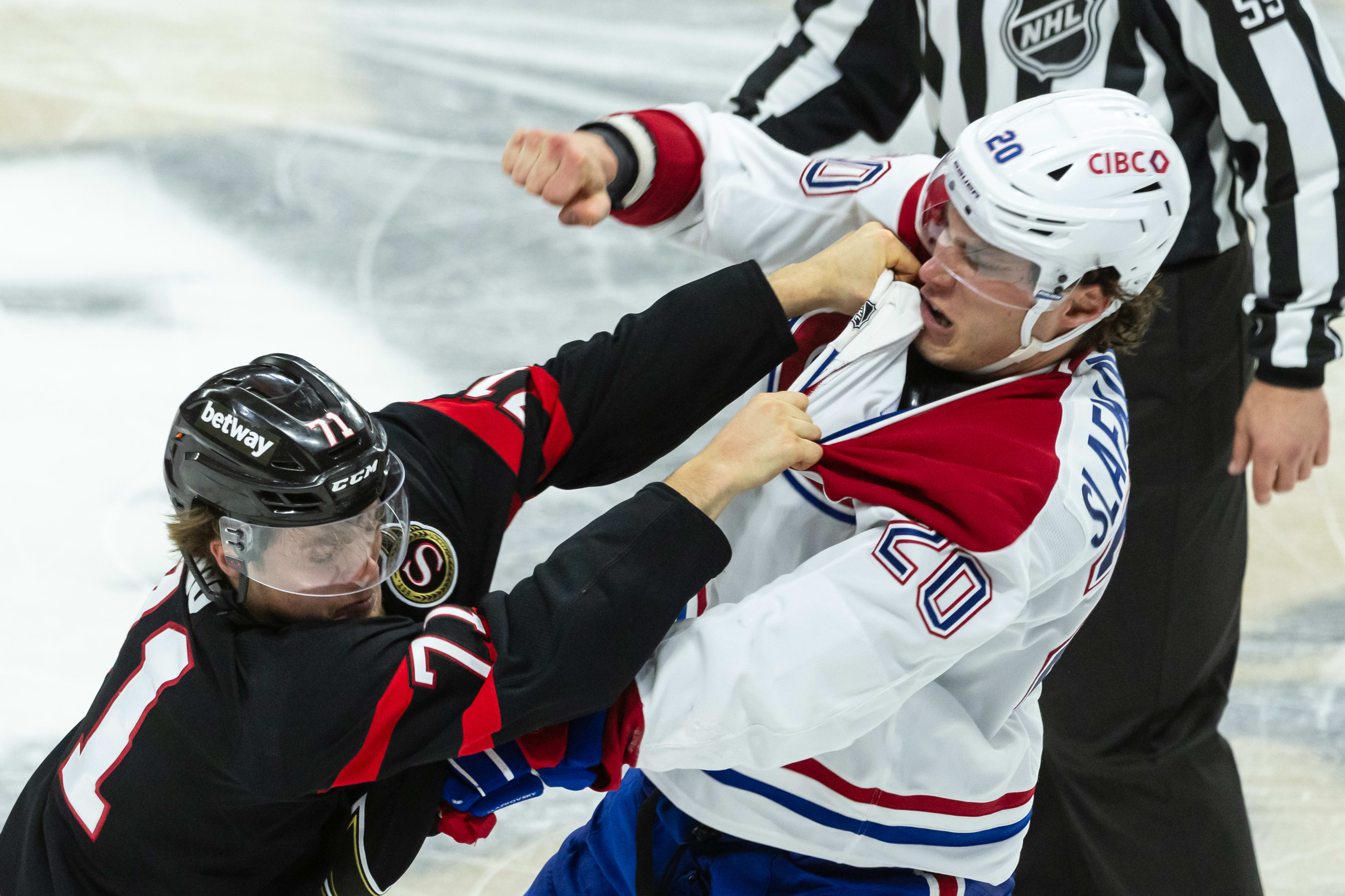 Ottawa Senators center Ridly Greig (71) fights with Montreal Canadiens left wing Juraj Slafkovsky (20).
