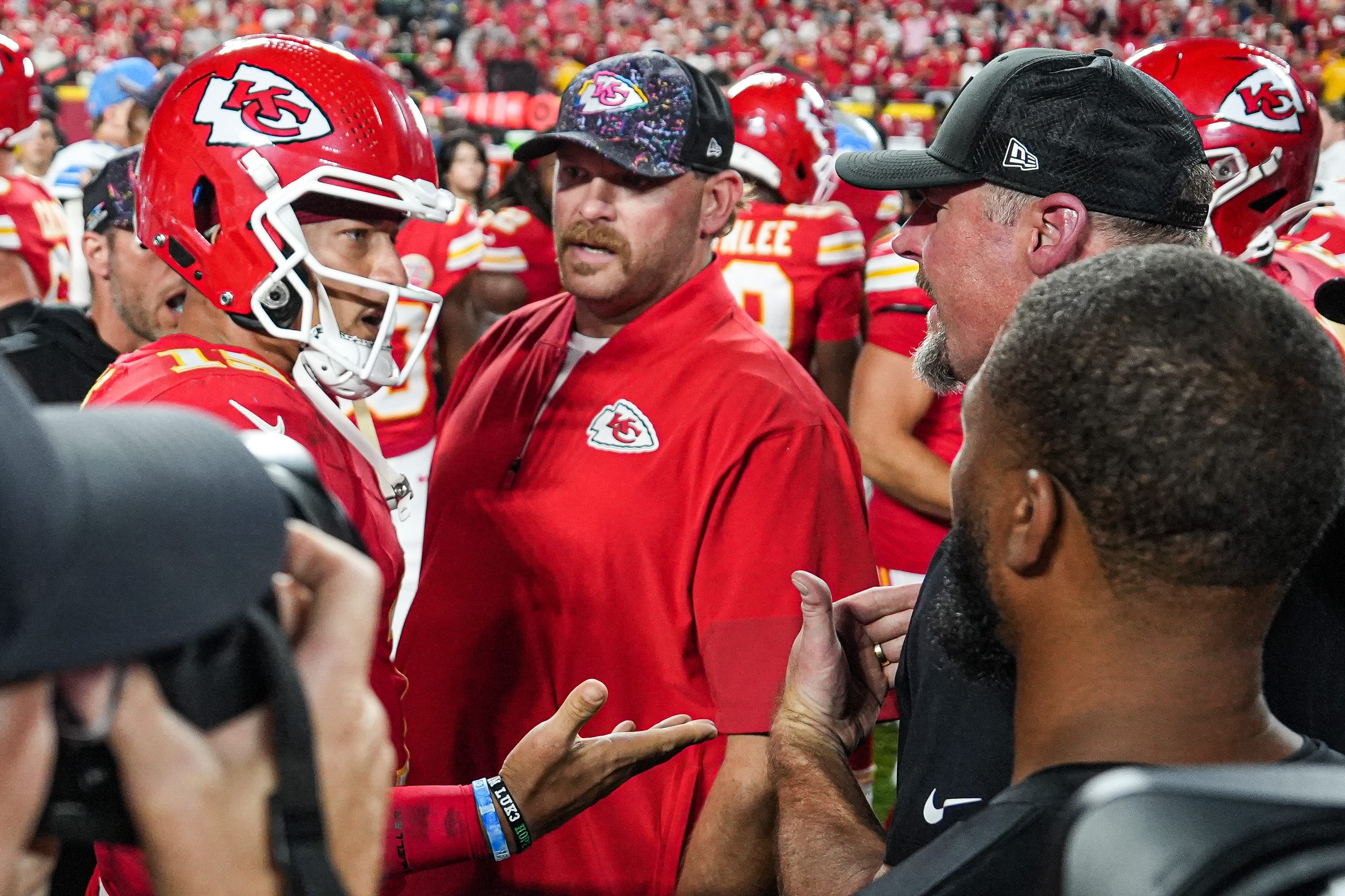 Kansas City Chiefs quarterback Patrick Mahomes (15), left, talks to Detroit Lions head coach Dan Campbell after the players scuffle at Arrowhead Stadium in Kansas City, Missouri on Sunday, Oct. 12, 2025.