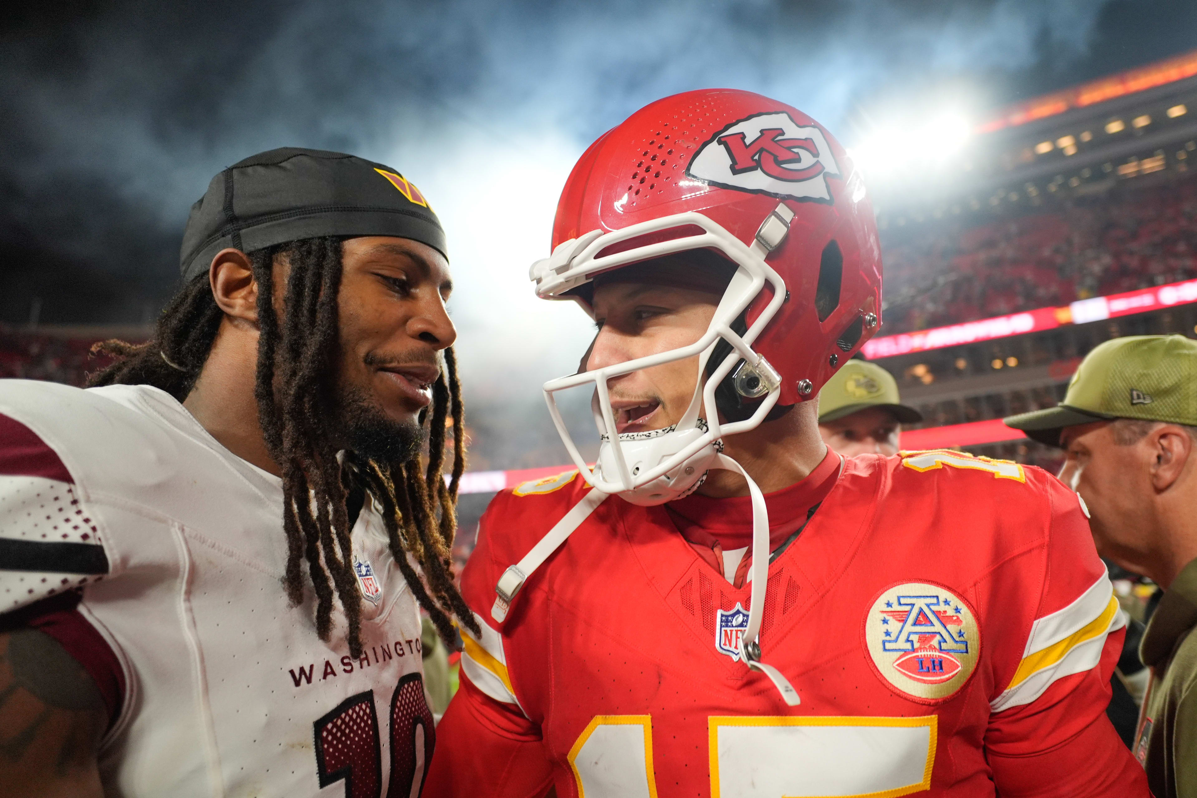 Commanders safety Tyler Owens and Chiefs quarterback Patrick Mahomes