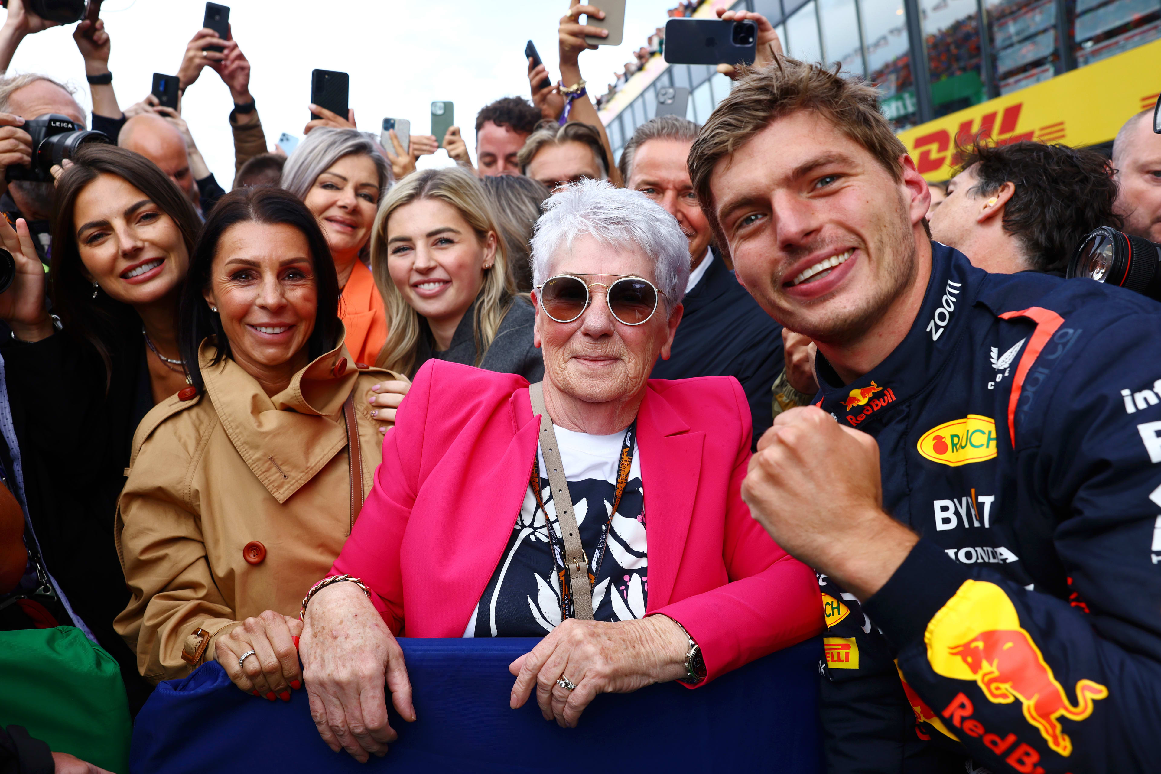 Max Verstappen with family celebrating after winning 2023 Dutch GP.