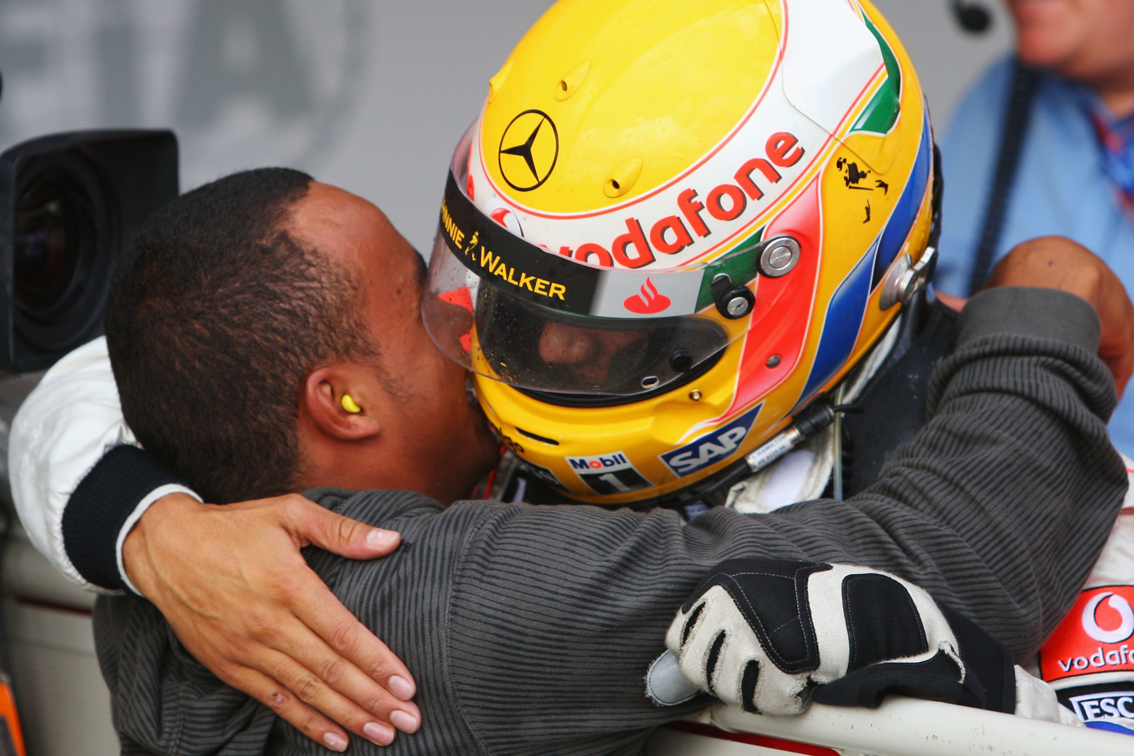 Lewis Hamilton celebrates with his brother Nicolas after winning the 2008 British F1 GP.