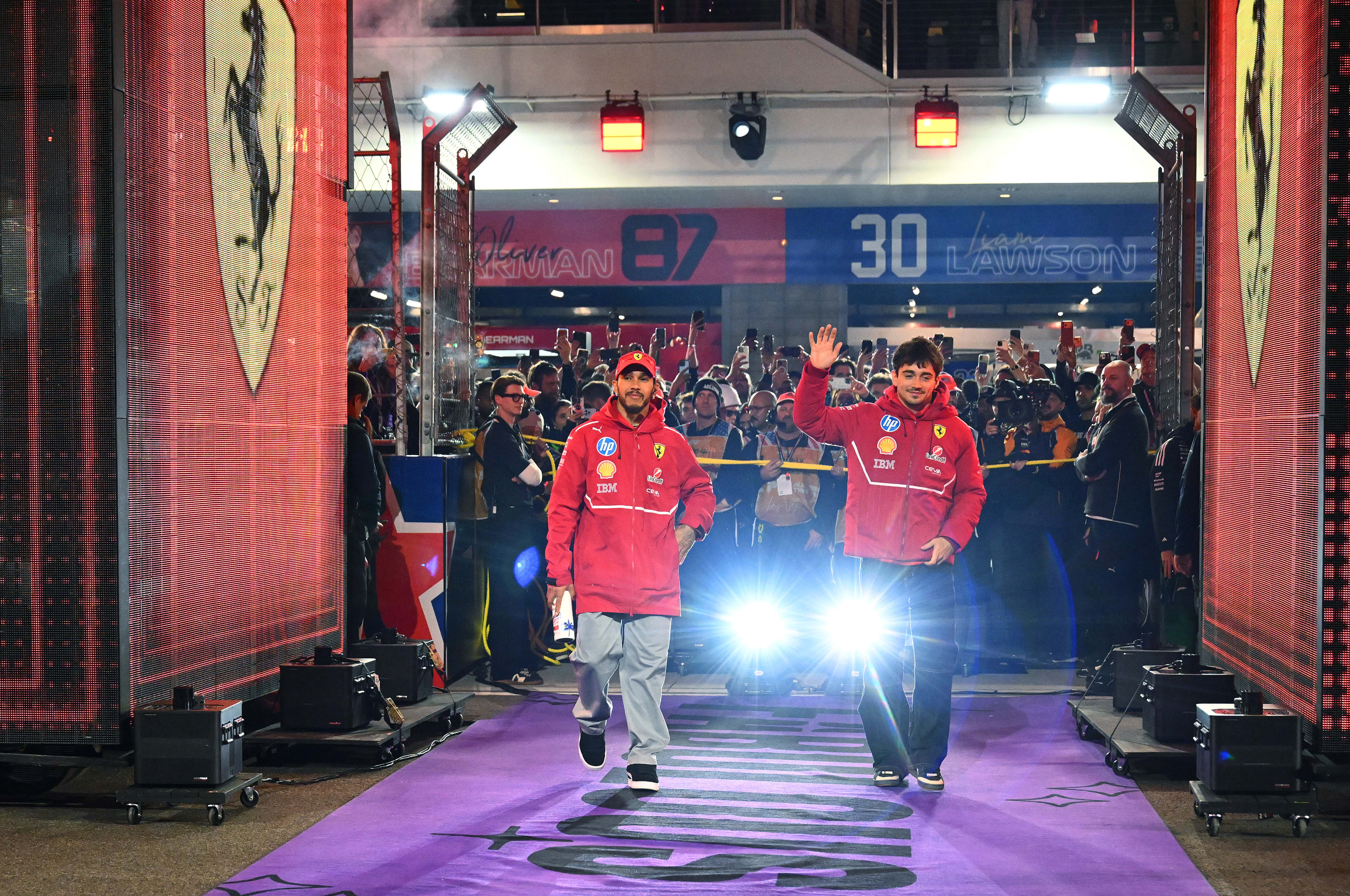 Lewis Hamilton of Great Britain and Scuderia Ferrari and Charles Leclerc of Monaco and Scuderia Ferrari on the drivers parade prior to the F1 Grand Prix of Las Vegas at Las Vegas Strip Circuit on November 22, 2025 in Las Vegas, Nevada.