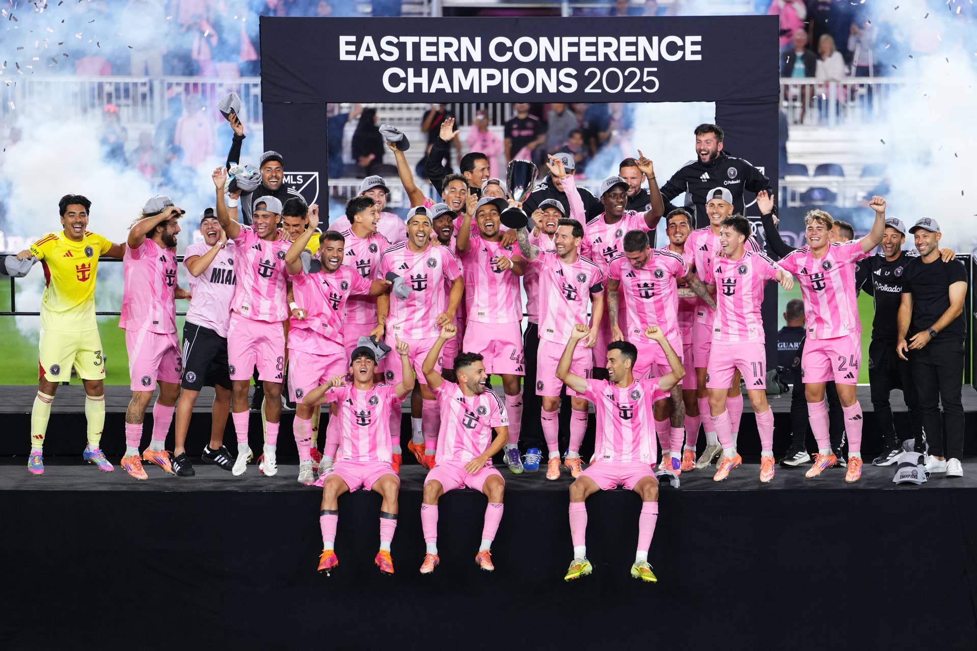 Lionel Messi #10 of Inter Miami CF lifts the Champions' trophy.