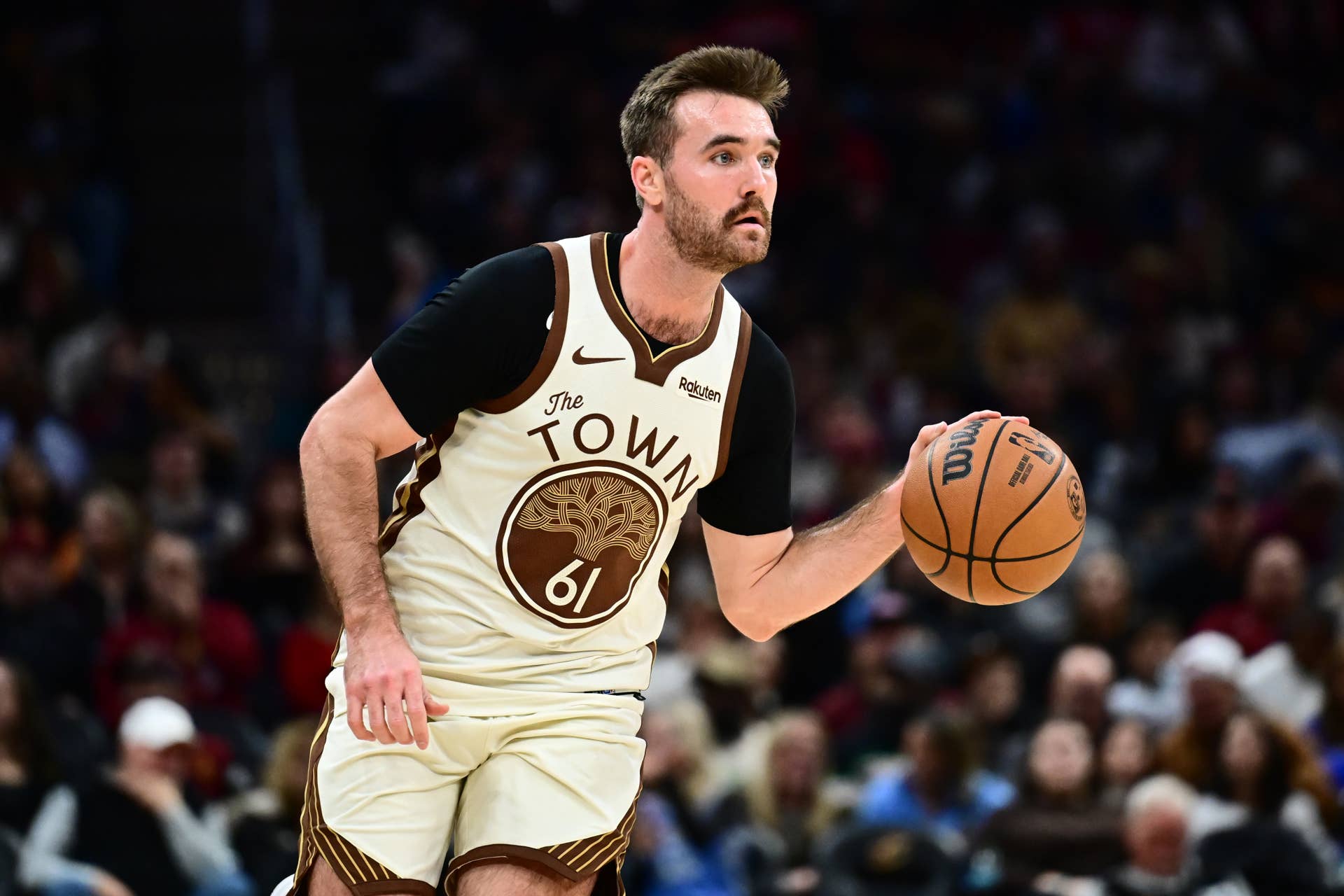 Golden State Warriors guard Pat Spencer (61) brings the ball up court against the Cleveland Cavaliers during the second half at Rocket Arena.