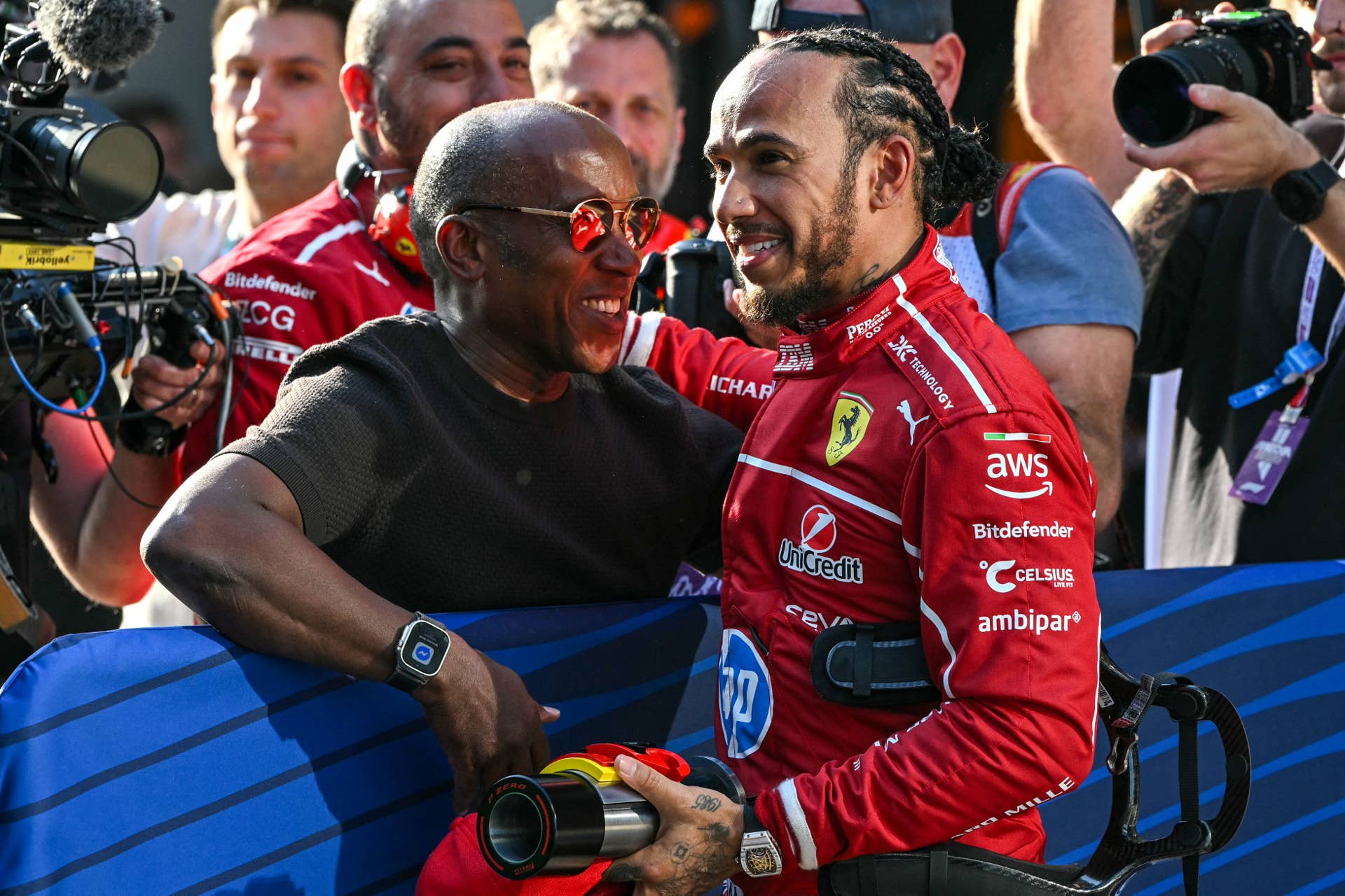 Lewis Hamilton celebrates with his father, Anthony Hamilton, at the 2025 Chinese Grand Prix sprint qualifying.