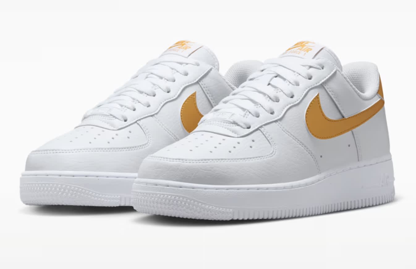 white nike air force with yellow tick